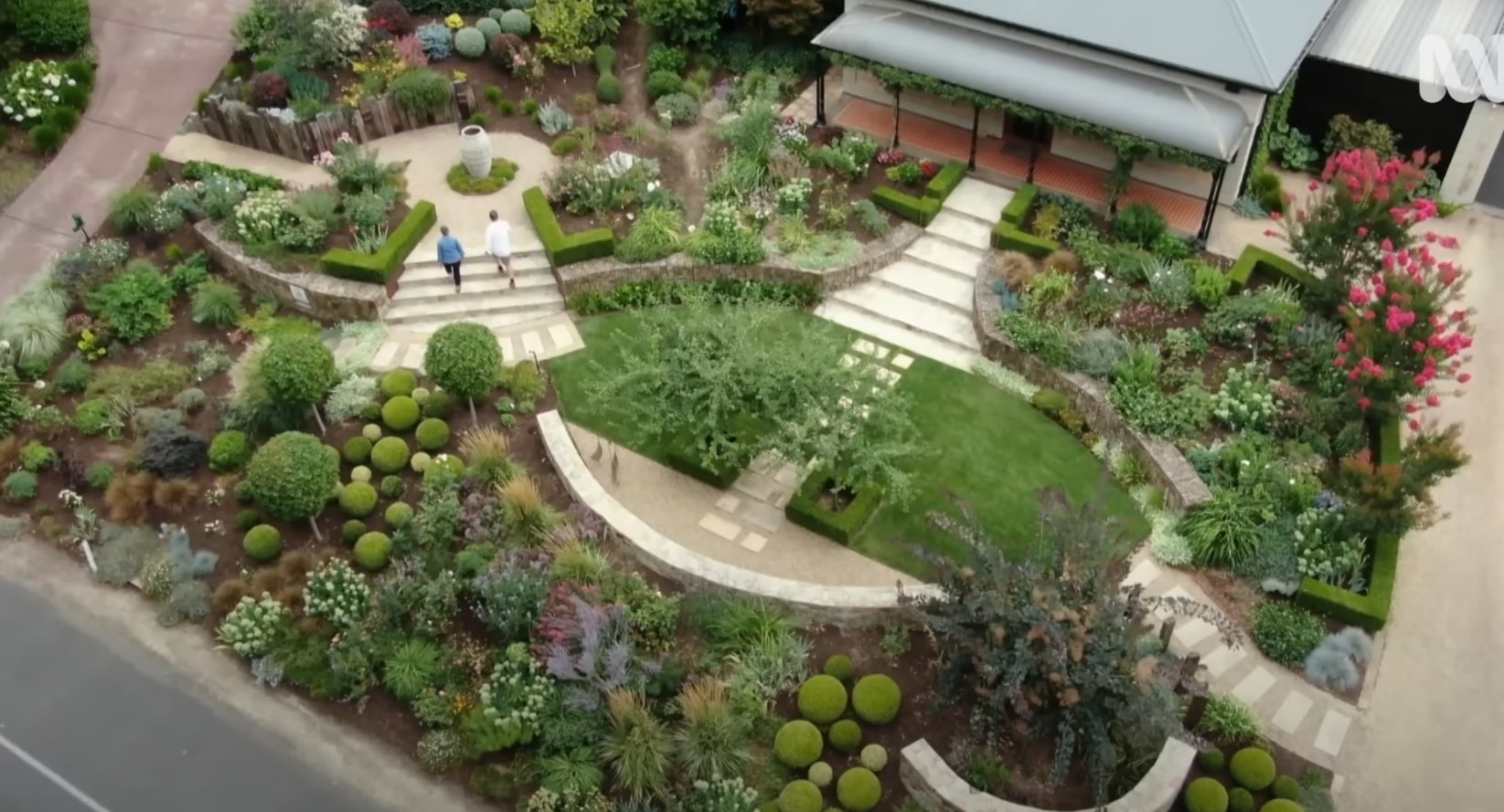 Stunning landscape design with curved pathways and diverse plantings